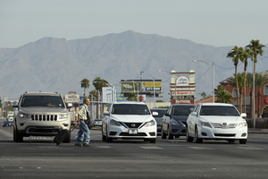 Pedestrain crosses Decatur Bouevard at West Sahara Avenue, looking north, Las Vegas, Nevada: digital photograph