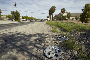 Hub caps on the side of Lindell Road, looking north, Las Vegas, Nevada: digital photograph