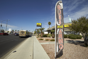 Gun and Ammo sign for business on West Sahara Avenue east of Lindell, looking west, Las Vegas, Nevada: digital photograph