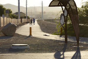 Couple walks dog on the Flamingo Arroyo Trail, looking east, Las Vegas, Nevada: digital photograph