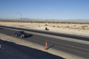 Car and pedestrians on Hollywood Boulevard north of East Sahara Avenue, looking west, Las Vegas, Nevada: digital photograph