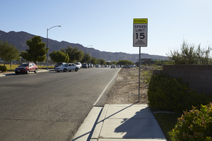 Sidewalk and undeveloped land on American Beauty Avenue, looking east, Las Vegas, Nevada: digital photograph