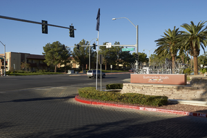 Apartment complex access road entrance on West Sahara Avenue east of Grand Canyon Drive, looking southwest, Las Vegas, Nevada: digital photograph