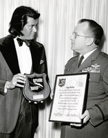 Wayne Newton being honored for a benefit performance by Major Richard Skeels: photographic print