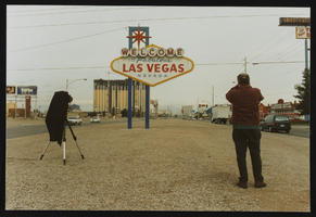 British filmmakers photographing the "Welcome to Las Vegas" sign: photographic print