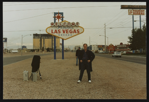 Dennis McBride poses in front of "Welcome to Las Vegas" sign: photographic print