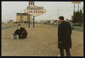 British filmmakers and Dennis McBride photographing the "Welcome to Las Vegas" sign: photographic print
