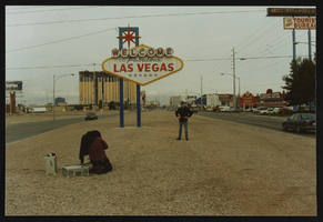 British filmmakers posing in front of the "Welcome to Las Vegas" sign: photographic print