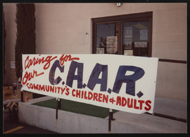 CAAR organization sign - "Caring for our C. A. A. R. Community's Children & Adults": photographic print