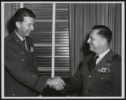 Howard Cannon is congratulated by Lieutenant General Bernard Schriever on Cannon's promotion to Brigadier General: photographic print