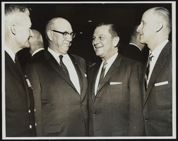 Rear Admiral Ignatius J. Galantin, George A. Probasco, Howard Cannon, and Edward R. Folsom speaking to each other: photographic print