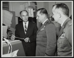 Howard Cannon views laser technology developments at the Air Force Avionics Lab at the Wright-Patterson Air Force Base, Ohio: photographic print