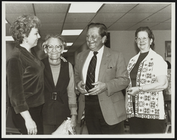 Howard Cannon with three unidentified women: photographic print