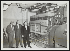 Howard Cannon with Jim Dodson and Jay Stone viewing the White Diesel engine: photographic print