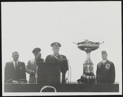 Howard Cannon on a platform with Major John Corcoran, General White, and Major Fitzgerald: photographic print
