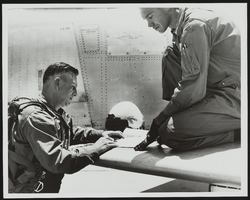 Howard Cannon at Nellis Air Force Base, Nevada, with Lieutenant Livingston in flight gear: photographic print