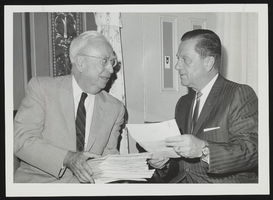 Howard Cannon speaking to an unidentified man: photographic print