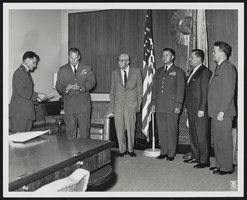 Howard Cannon with unidentified men at a medal award ceremony: photographic print