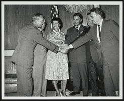 Howard Cannon with unidentified men at a medal award ceremony: photographic print