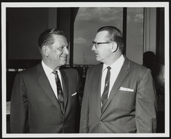 Howard Cannon speaking with an unidentified man: photographic print