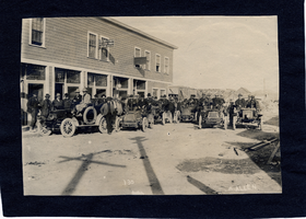 Unidentified group pose around an automobile, image 002: photographic print