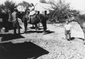 Virginia Tubb getting a kiss from her horse: photographic print