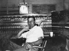 David Walker "Deke" Lowe, Jr., at the central train control panel, Union Station, Las Vegas: photographic print