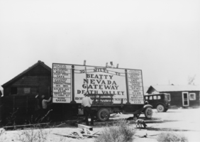 Highway sign is being readied at the Beatty Auto Court: photographic print