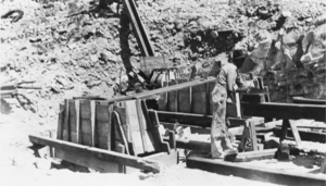 Charles E. Phinney working on a concrete form at the Gold Ace Mill, Nevada: photographic print