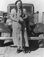 Grace Davies with a bobcat that her husband, Fred Davies, had trapped: photographic print