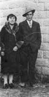 Mayme Hooper and her husband Albert Hooper in front of Stone House on their ranch in Monitor Valley, Nevada: photographic print