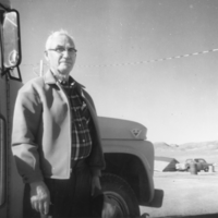 Madison Locke in front of school bus, Sarcobatus Flats: photographic print