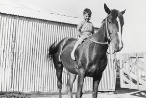 Karl "Skook" Berg riding a horse named Pardner on the Berg Ranch, Nevada: photographic print