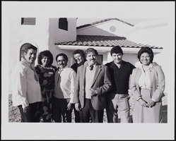 Officers of Council #11081 standing in front of completed LULAC Multi-Purpose Bilingual Senior Center building: black-and-white photographs