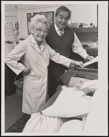 Rafael Vega and his mother, Mary, standing inside one of their many businesses: black-and-white photographs