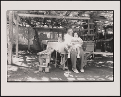 Emilia Pachecho holds granddaughter Amber Sanchez under a fig tree at their family home in Las Vegas, Nevada: black-and-white photographs