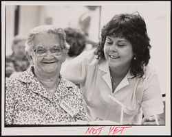 Delia Gonzalez (right) supervises elderly client Rufina Ruiz at an Adult Daycare facility in Las Vegas, Nevada: black-and-white photographs
