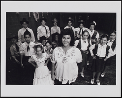 Martha Luevanosthe, Director of Ballet Folklorico De Las Vegas, stands with members of her dance troupe: black-and-white photographs