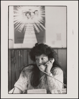 Argentinian Olga Carbia speaks on the telephone to a Spanish-speaking client: black-and-white photographs