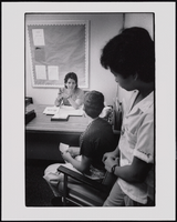 Assistant Principal Gina Valverde White speaks with two Hispanic high school students at Las Vegas High School: black-and-white photographs