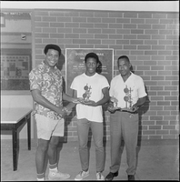 Set of photographs including Sarann's, Title V Summer Program party, Otis Harris and family, Elder Sanders, baseball trophy winners at Doolittle, and Reverend Bennett and family