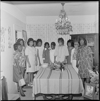 Set of photographs including Heublen's Baer advertisement, Ragena's birthday party, basketball winner, Helen Anderson and campaign workers, Doolittle banquet, and late Brother Dawson, 1968