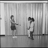 Set of photographs including a party at Doolittle, Roseann Katt in a physical fitness program, Mrs. Raggsdale, Joe Haynes' party, Judo class, Arthur Ashe at Pughsleys, Mother Porter, and couches