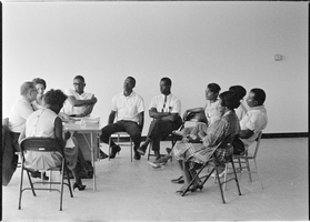Set of photographs including Matt Kelly basketball team, Kappas intern at Doolittle Center, Mrs. Goldie Johnson Anniversary, and Small Business Loan meeting