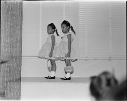 Set of photographs including fashion show at Jefferson Child Care, and car crash at Sugar Hill