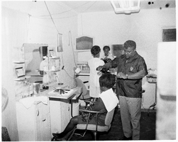 Set of photographs of Earl's barber shop