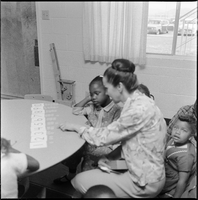 Set of photographs including Operation Independence child care center