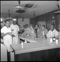 Set of photographs including Robinson and Wyn children, Bass and Dorothy Johnson at B and B Cleaners, Jo Mackey class at Pepsi Cola, Doolittle Senior Cooking Class, and Savoy Cafe