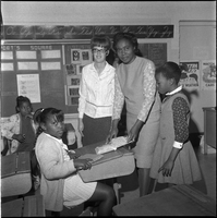 Set of photographs including baby on H Street, Madison Negro History Week, and Westside School teachers