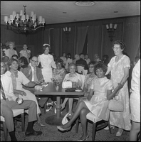 Set of photographs including Martha Abby's baby, Mrs. Mabel Hoggard's retirement reception, and car accident on Las Vegas Boulevard